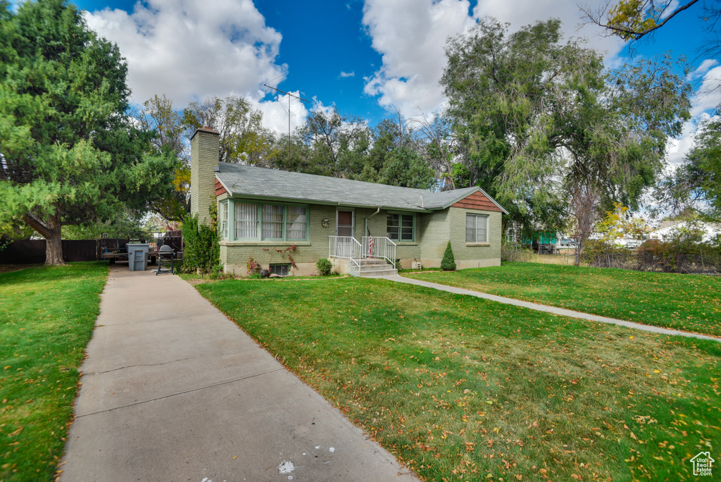 View of front of property with a front lawn