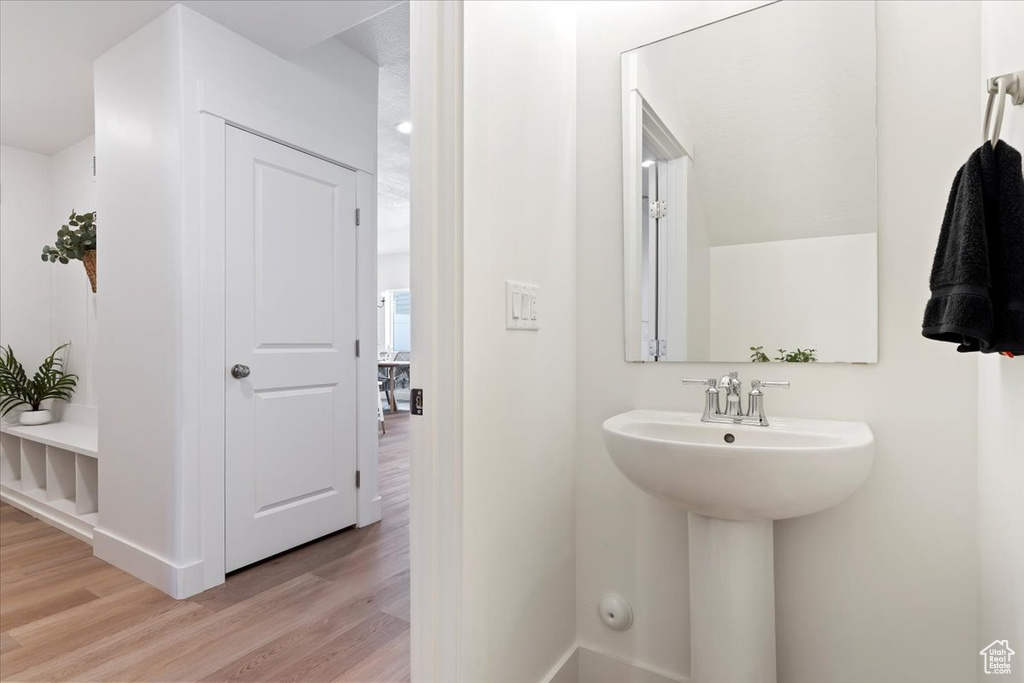 Bathroom featuring hardwood / wood-style floors and sink