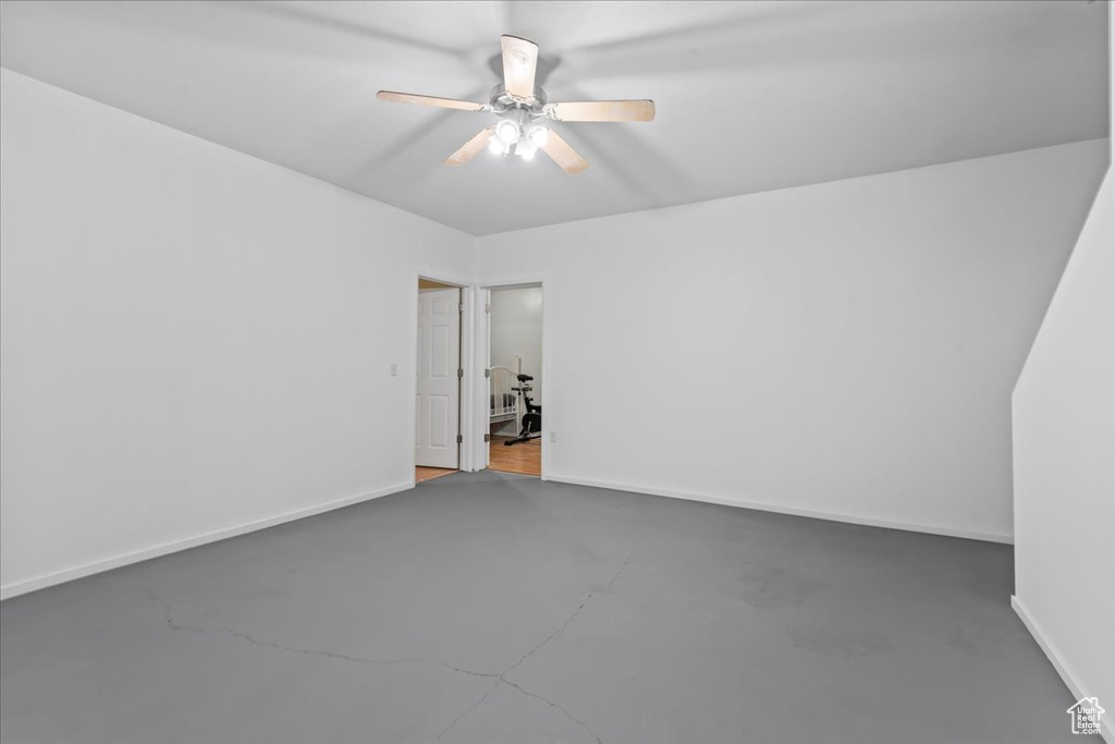 Spare room with ceiling fan