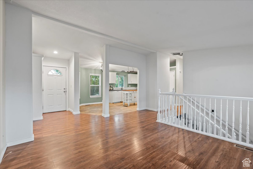 Spare room featuring wood-type flooring