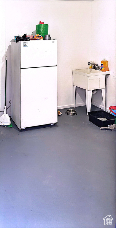 Kitchen featuring white refrigerator