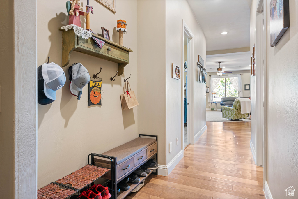 Corridor with light hardwood / wood-style floors