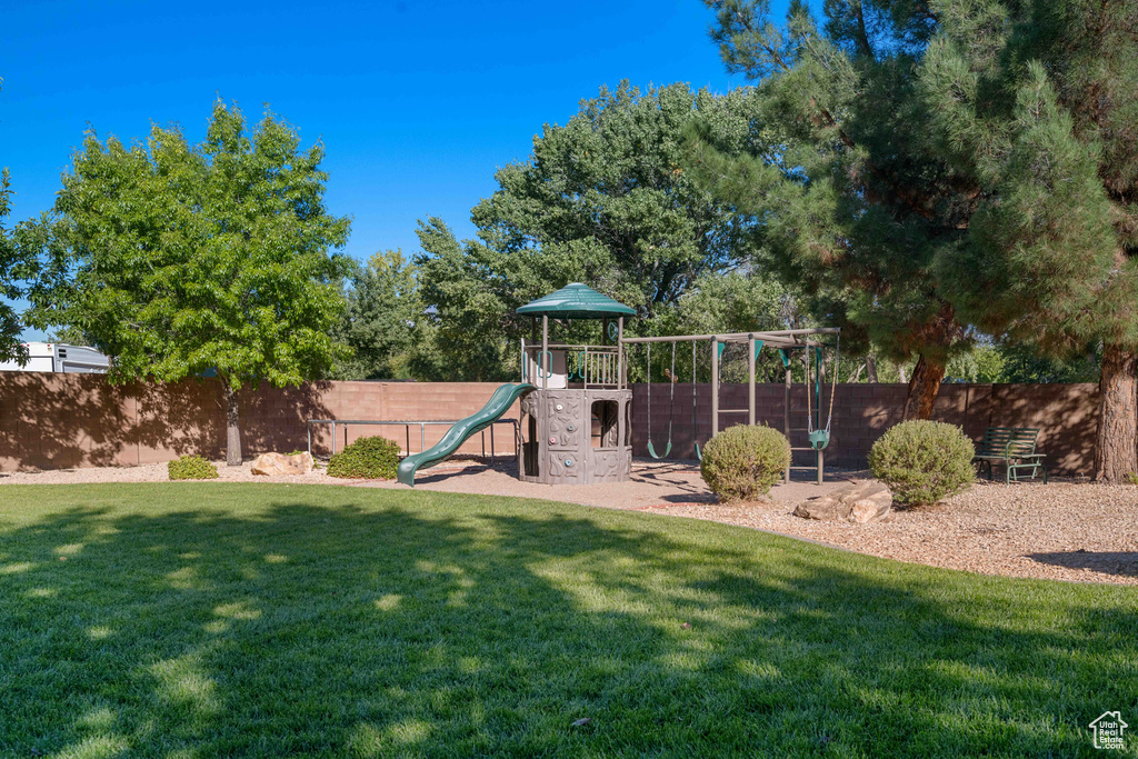 View of play area with a lawn