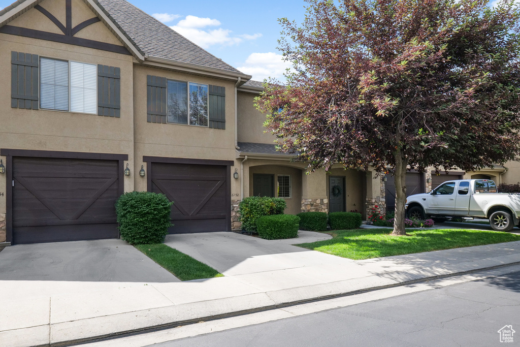 View of front facade featuring a garage