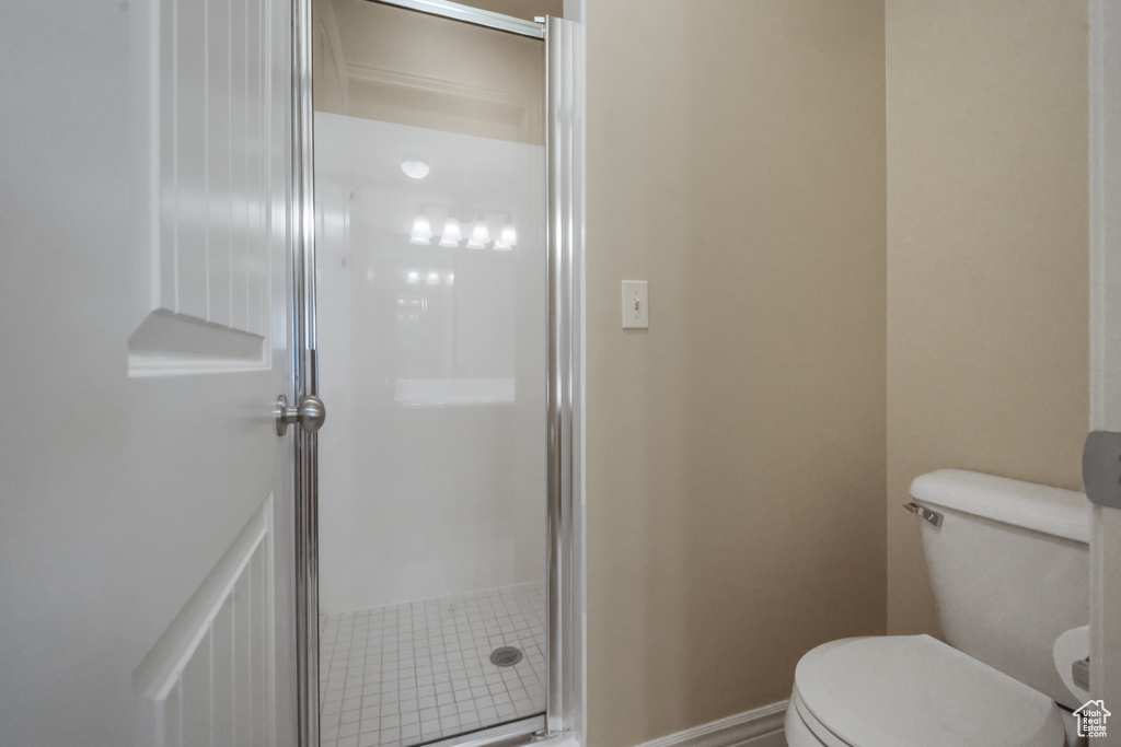 Bathroom with toilet and an enclosed shower