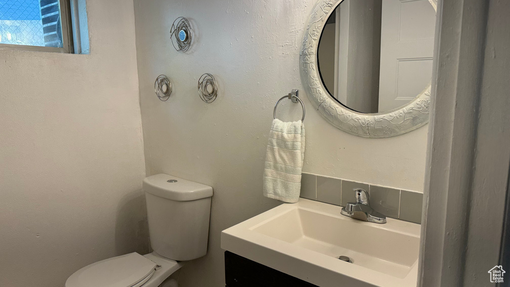 Bathroom with vanity and toilet