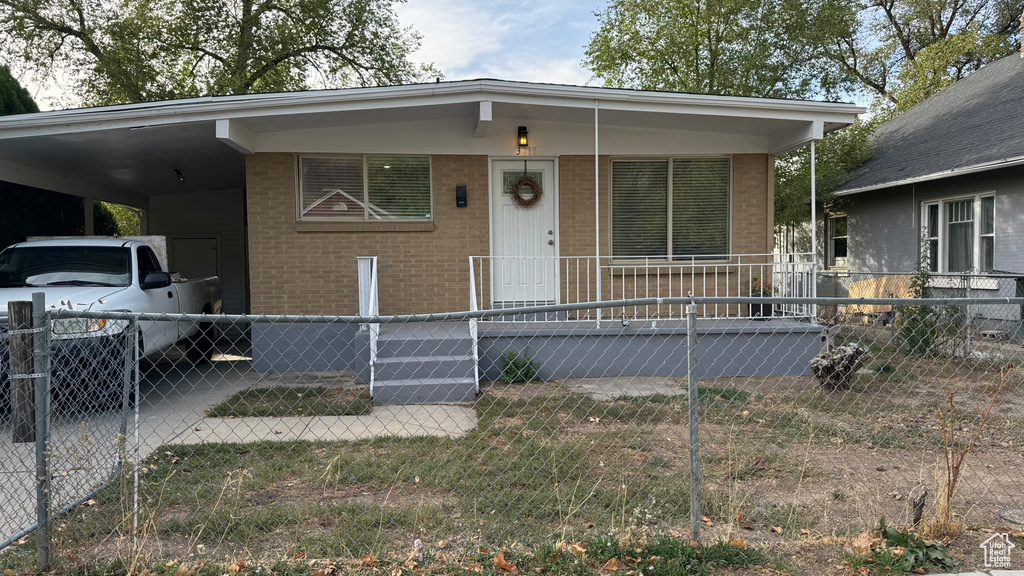 View of front of house featuring a carport