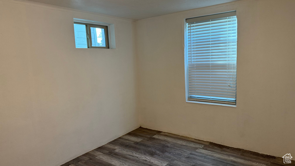 Spare room featuring dark hardwood / wood-style floors