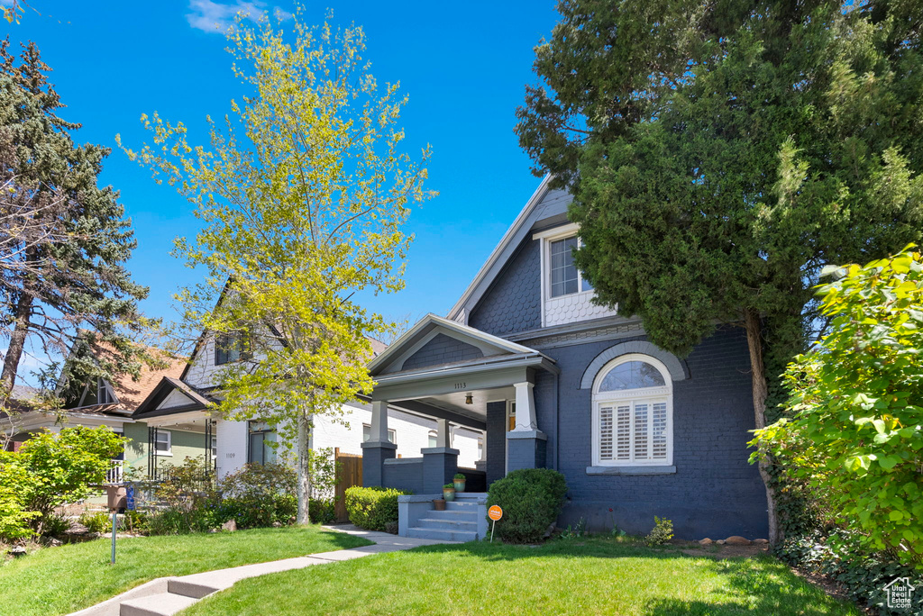 View of front of house with a front lawn