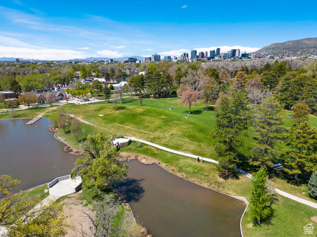 Birds eye view of property featuring a water and mountain view