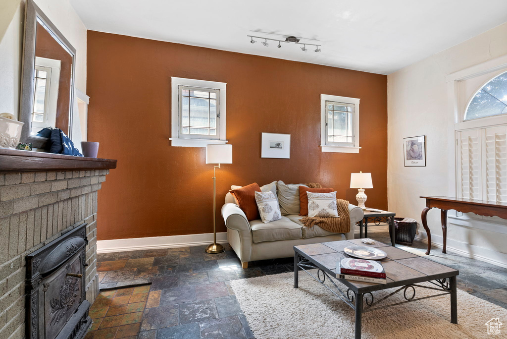 Living room with a brick fireplace