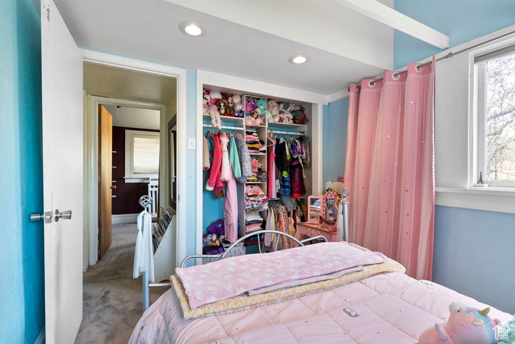 Bedroom with a closet and carpet floors