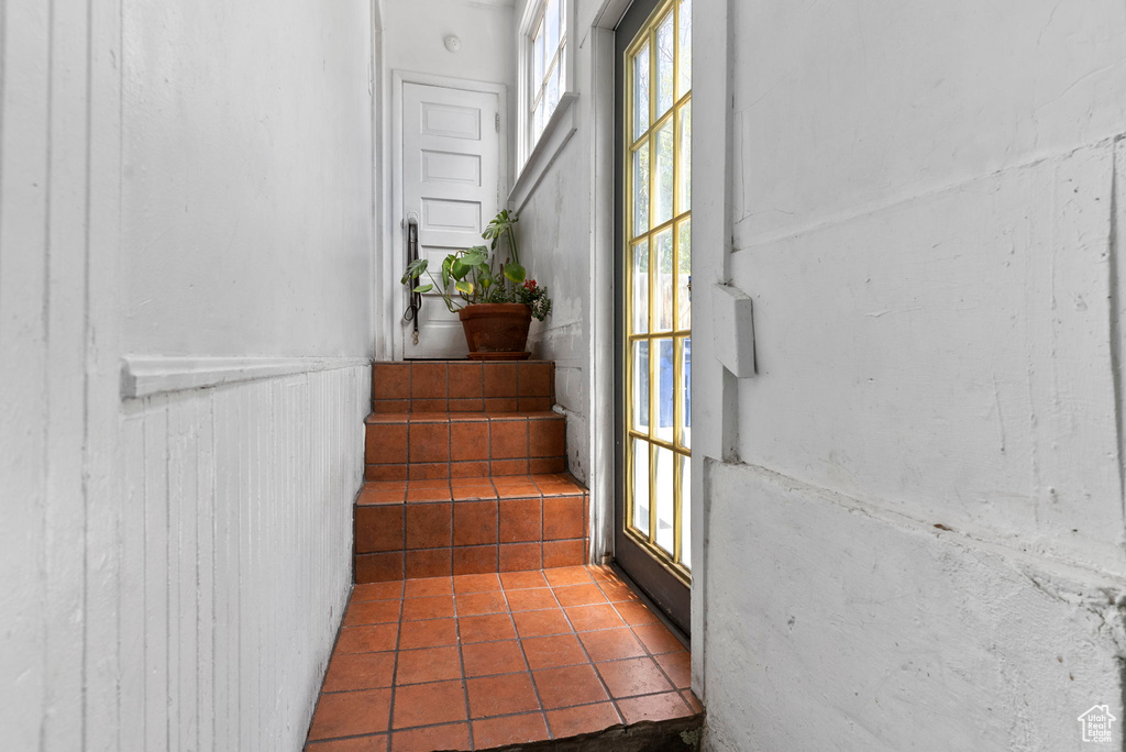 Stairway featuring plenty of natural light