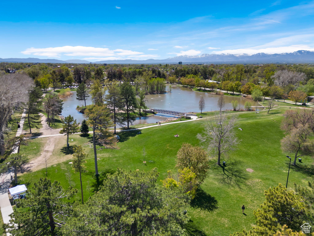 Birds eye view of property with a water and mountain view