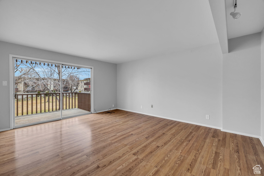 Spare room featuring hardwood / wood-style flooring