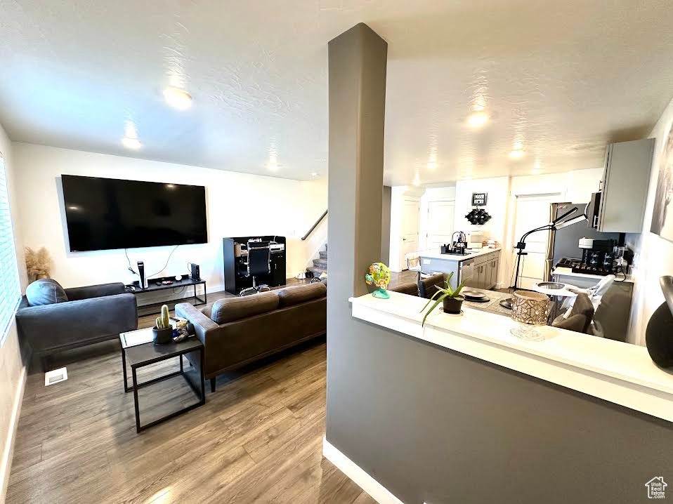 Living room with light wood-type flooring