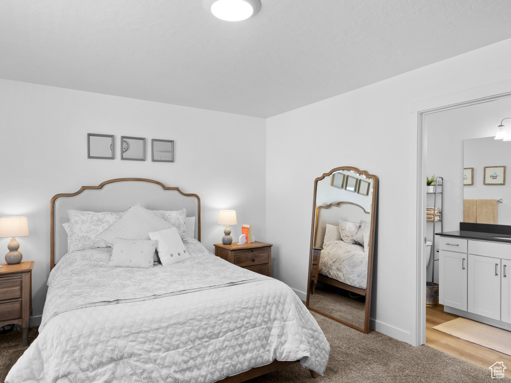 Bedroom with light hardwood / wood-style floors