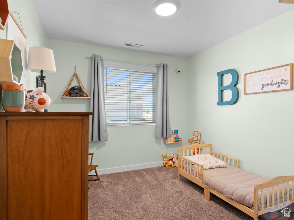 View of carpeted bedroom