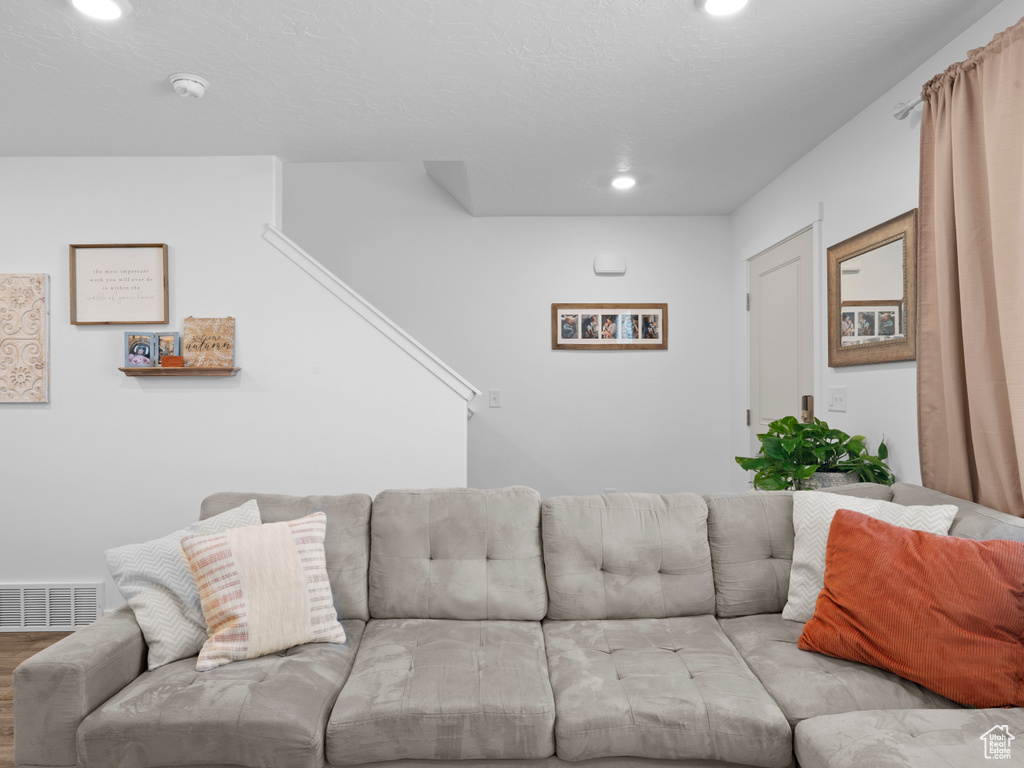 Living room with light hardwood / wood-style flooring