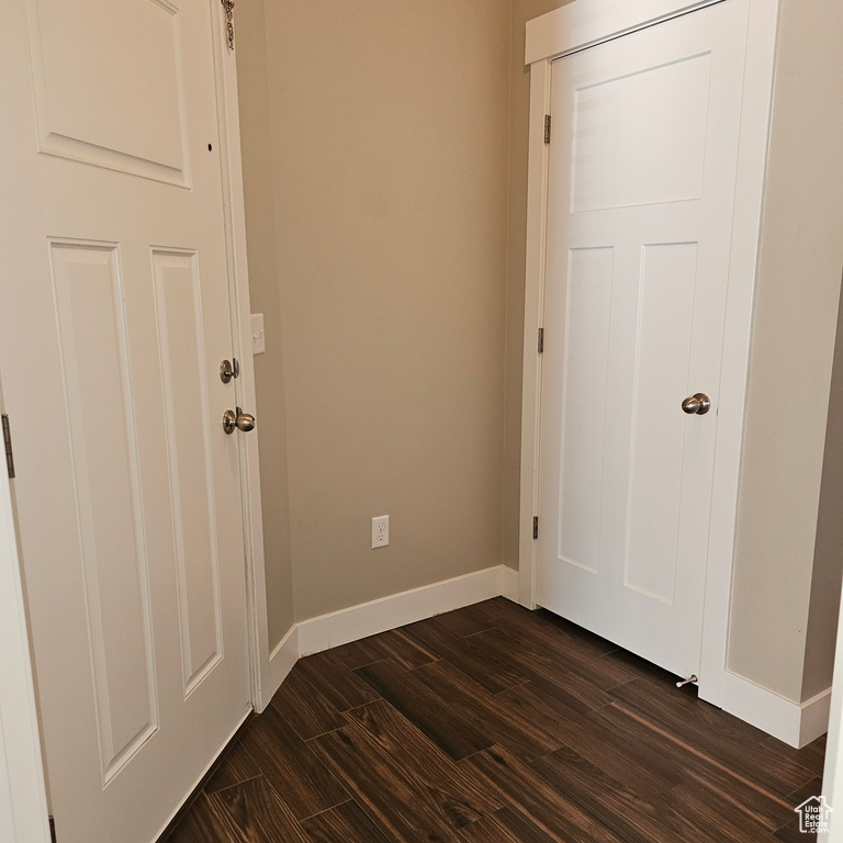 Interior space featuring dark wood-type flooring