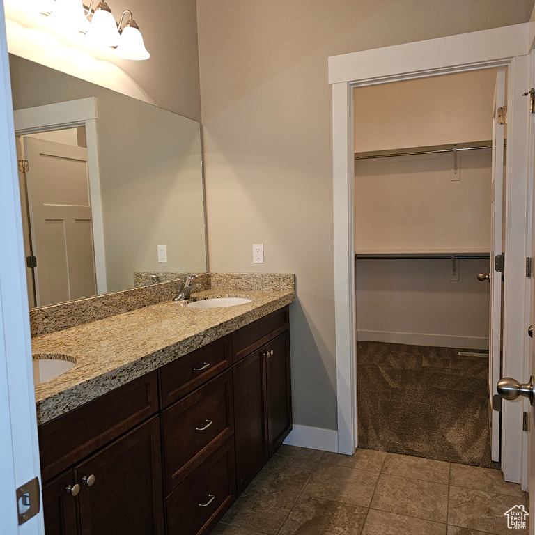 Bathroom with vanity and tile patterned floors