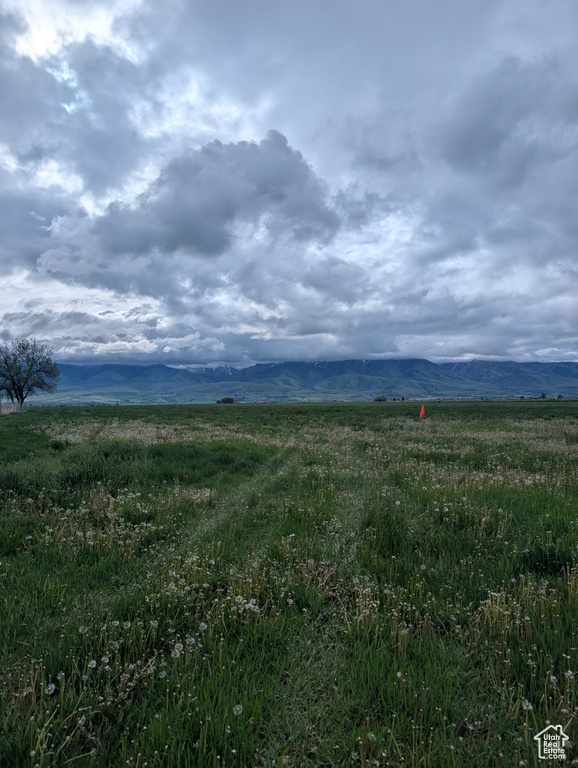 View of mountain background featuring rural landscape