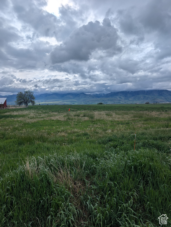 View of undeveloped land featuring rural landscape and a mountainous background