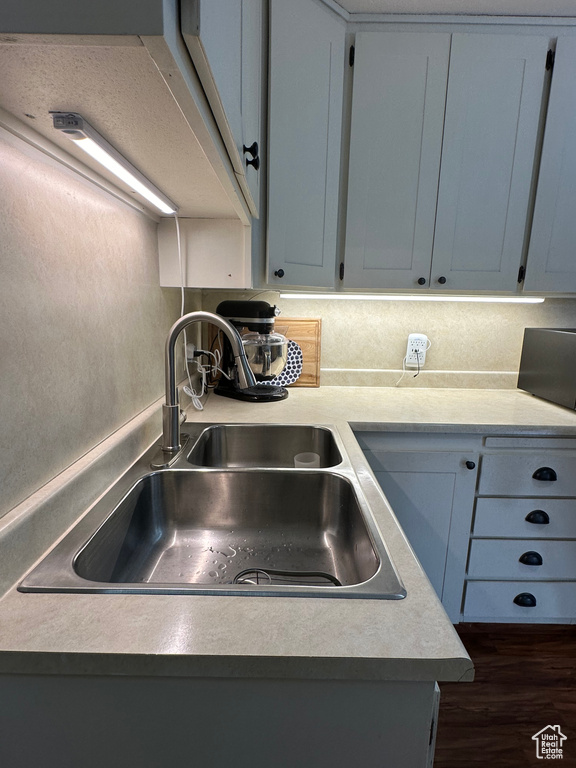 Interior space featuring sink, dark wood-type flooring, and gray cabinetry