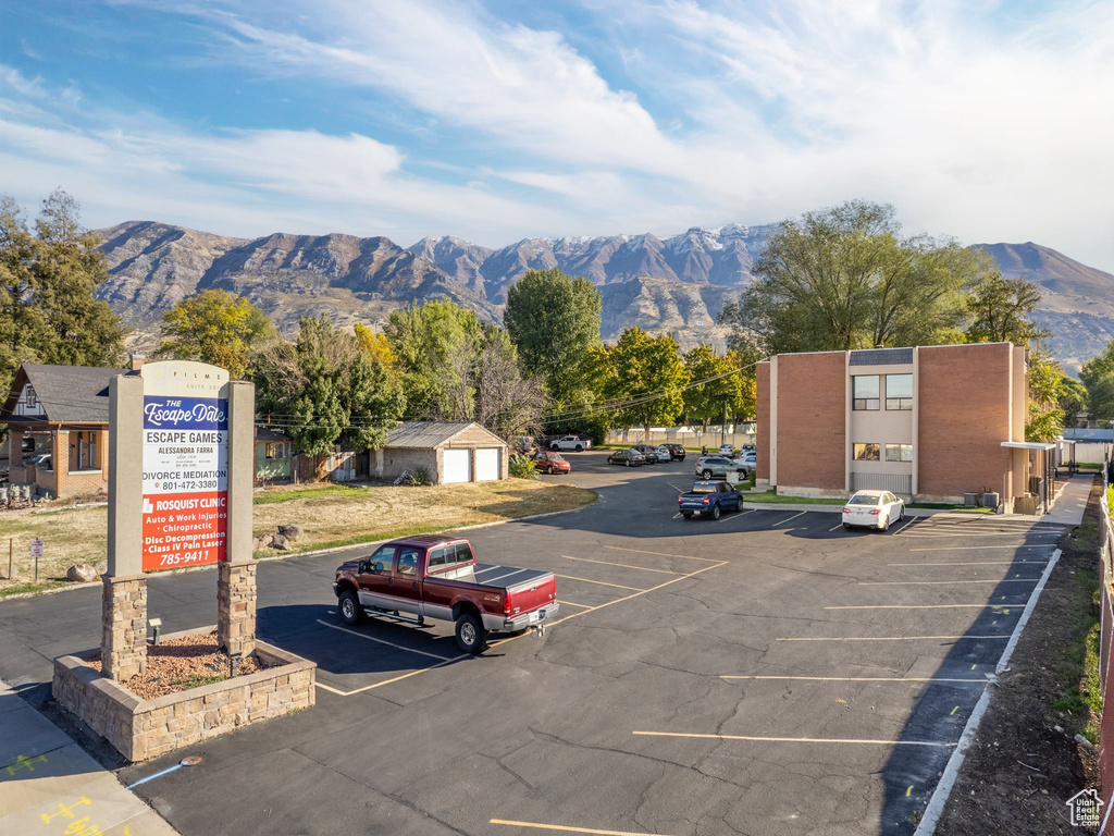 View of parking with a mountain view