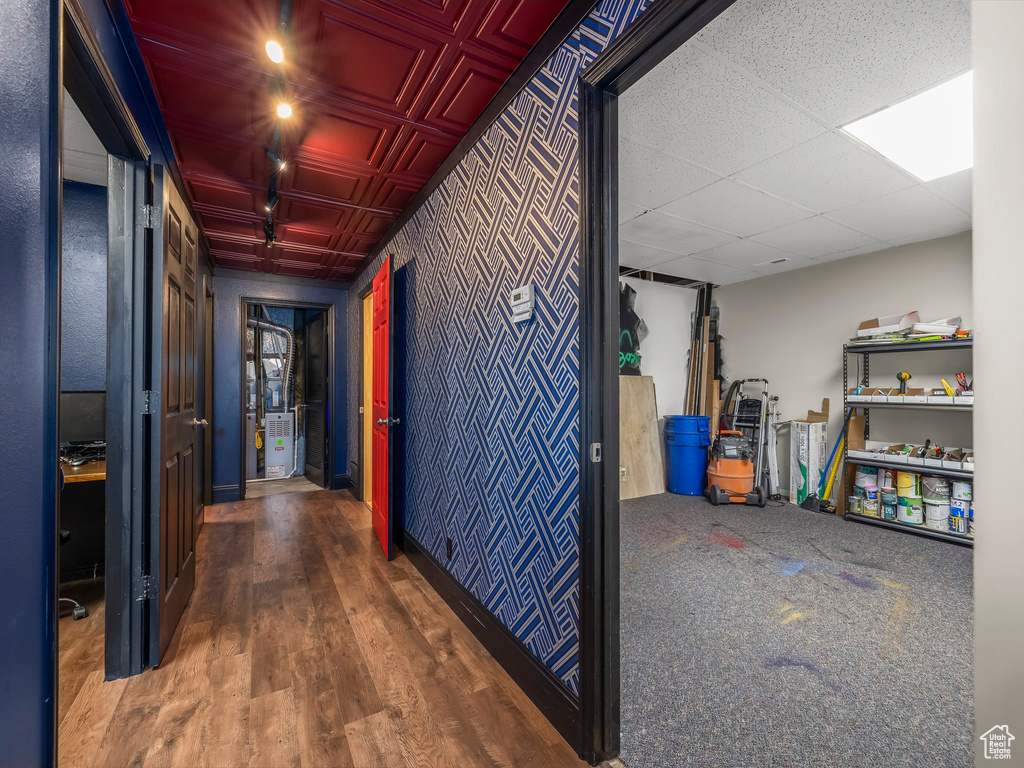 Corridor featuring hardwood / wood-style flooring