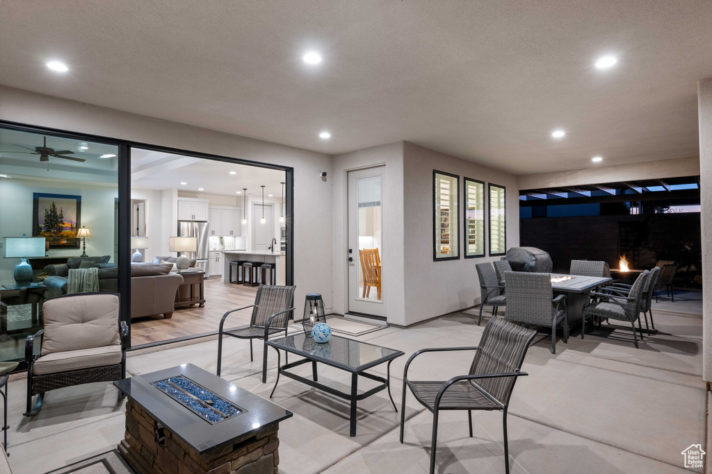 Living room featuring light hardwood / wood-style floors and ceiling fan