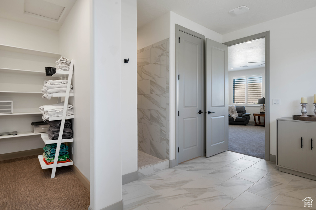 Bathroom featuring a tile shower