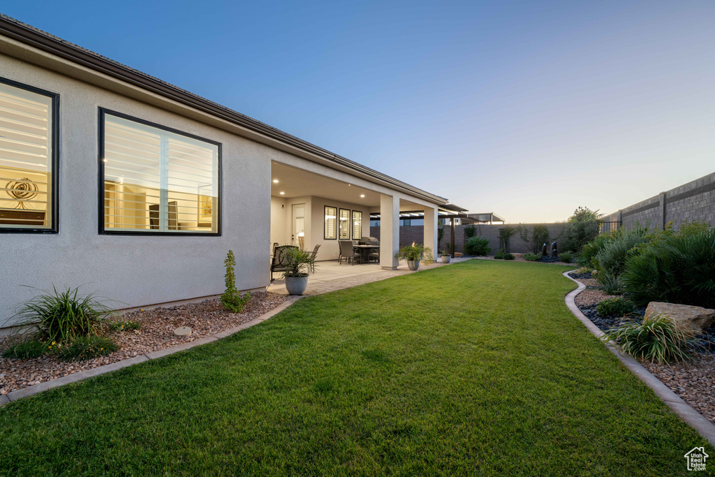 Yard at dusk with a patio