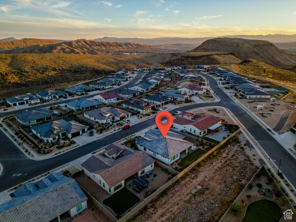 Aerial view at dusk featuring a mountain view