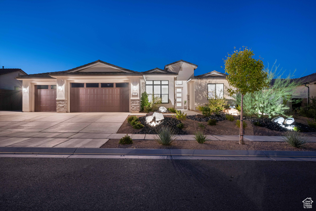 Prairie-style house featuring a garage