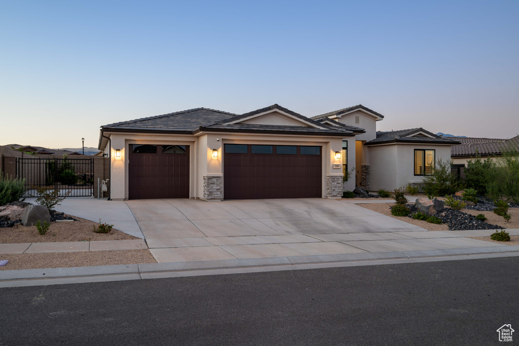 View of front of property featuring a garage