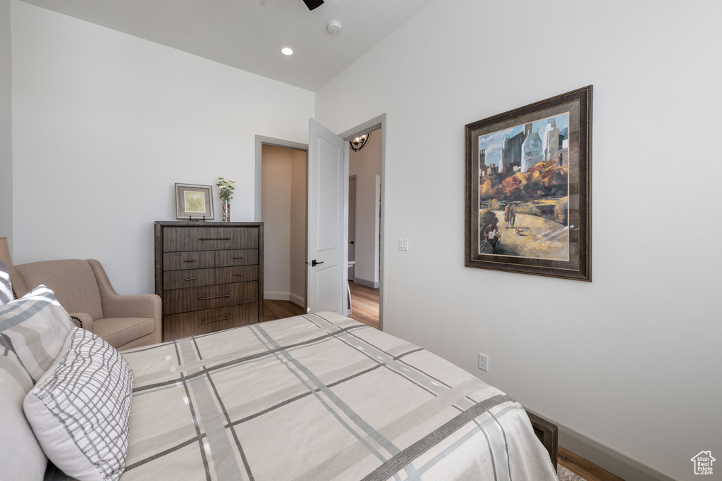 Bedroom with hardwood / wood-style floors