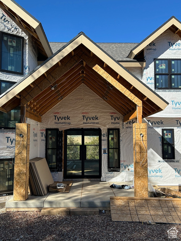 View of exterior entry featuring french doors