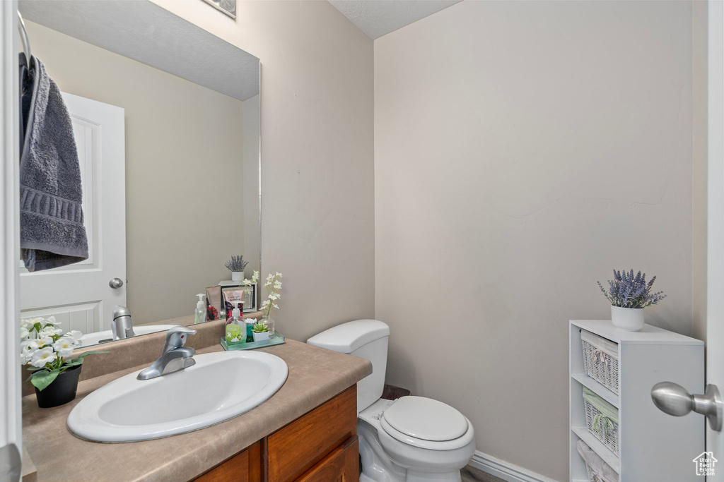 Bathroom with vanity and toilet