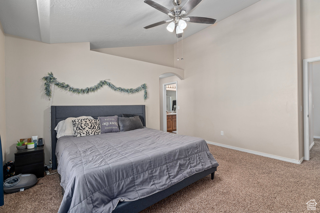 Bedroom with carpet, vaulted ceiling, and ceiling fan