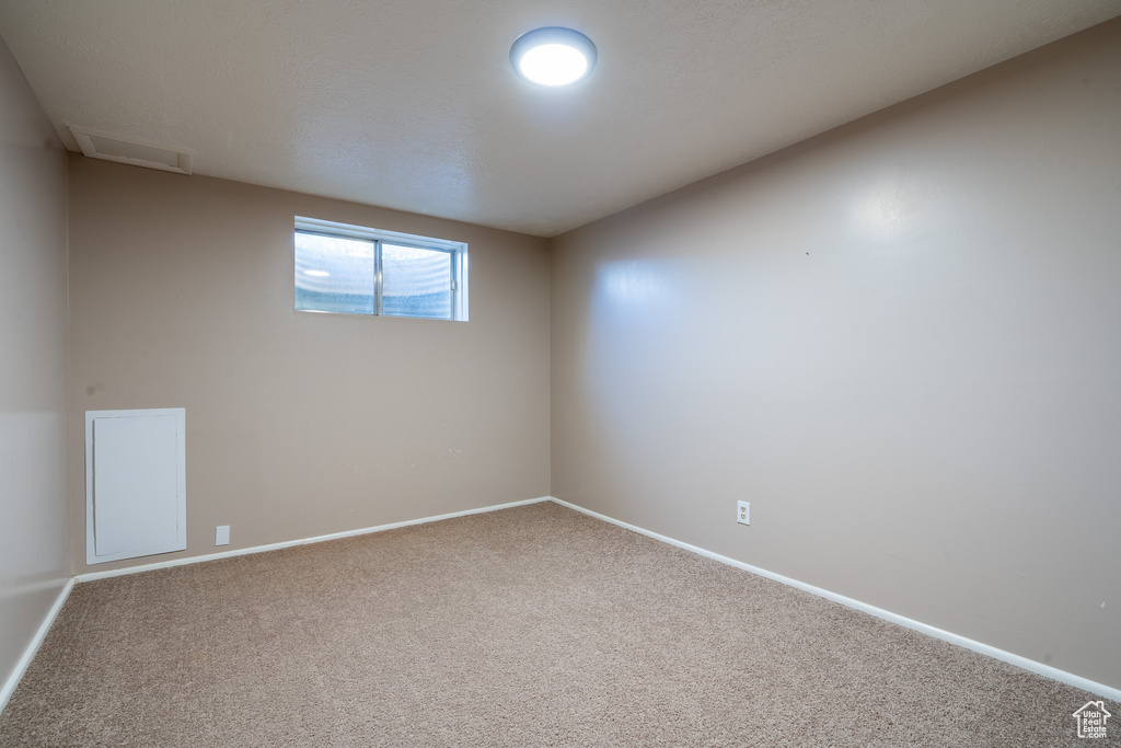 View of carpeted spare room