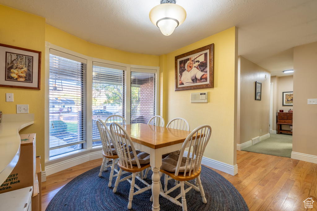Dining space featuring light wood-type flooring