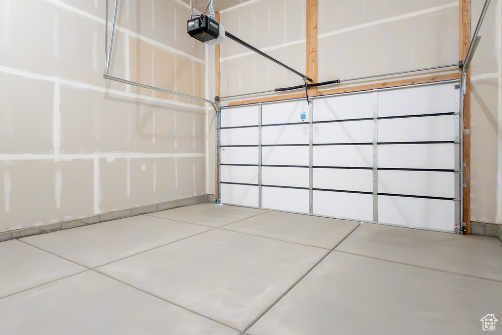 Garage featuring a garage door opener