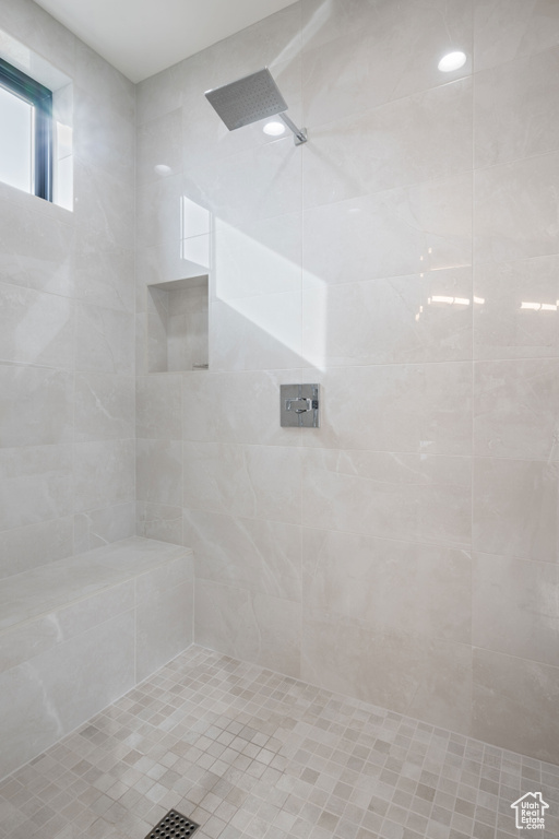 Bathroom featuring tiled shower