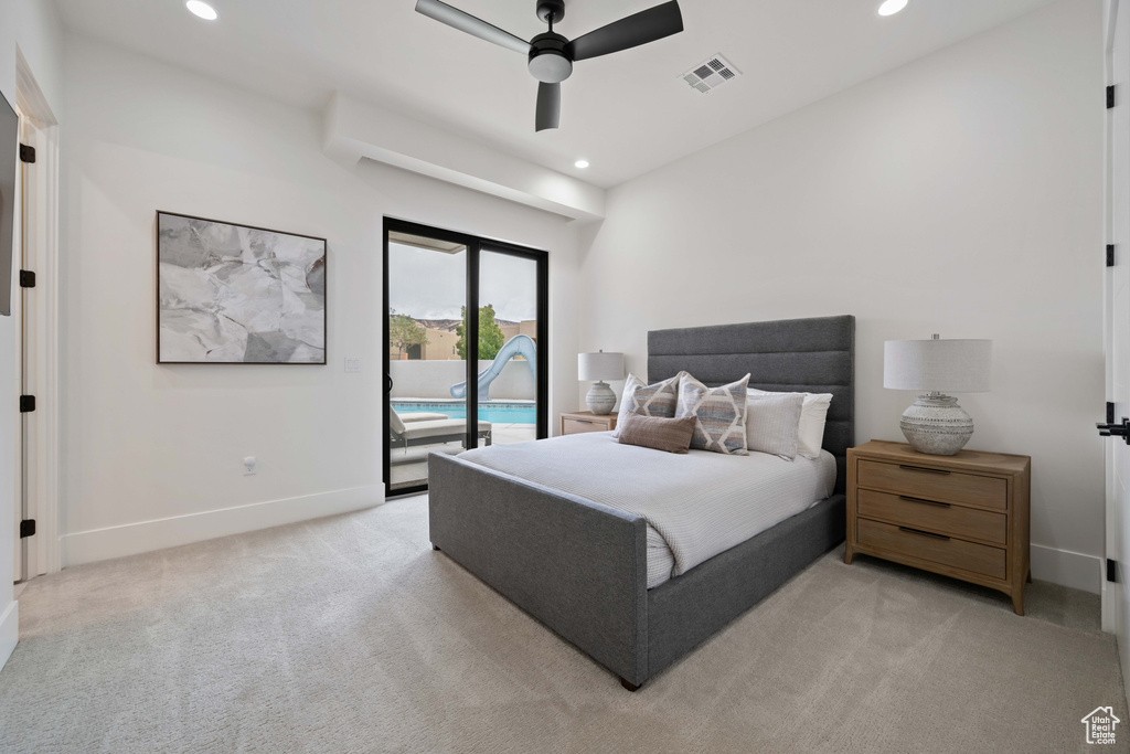 Bedroom featuring access to exterior, light colored carpet, and ceiling fan