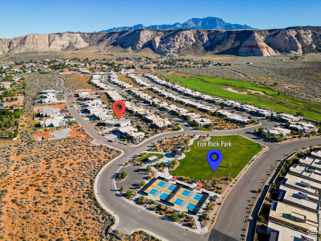 Birds eye view of property with a mountain view