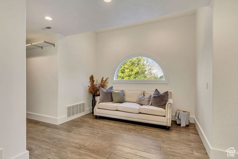 Living area with light wood-type flooring