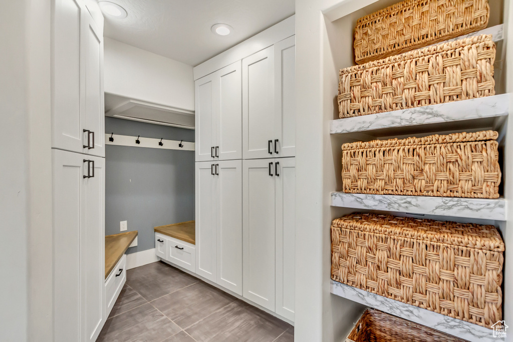 Mudroom featuring dark tile patterned flooring