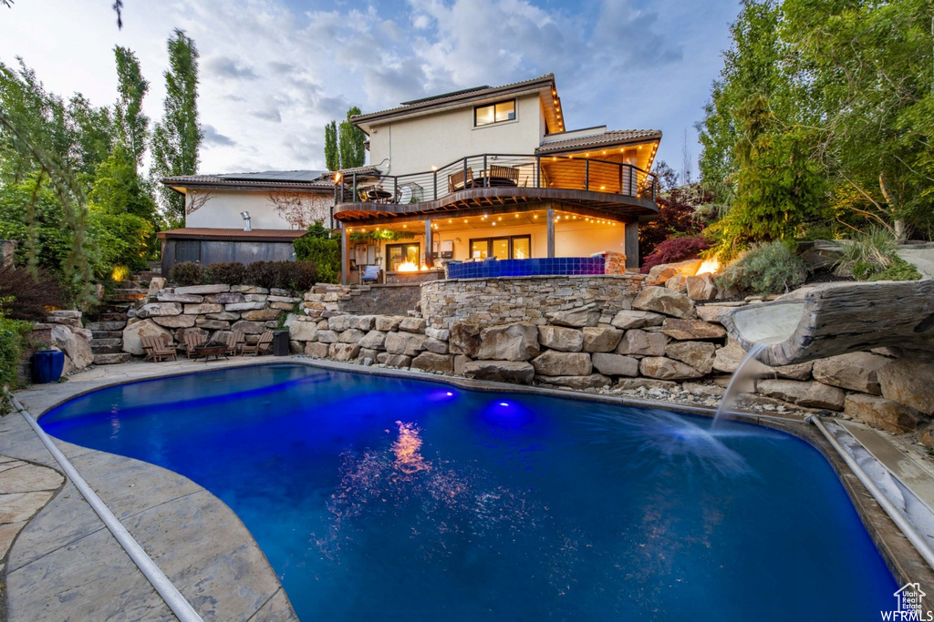 View of pool featuring pool water feature