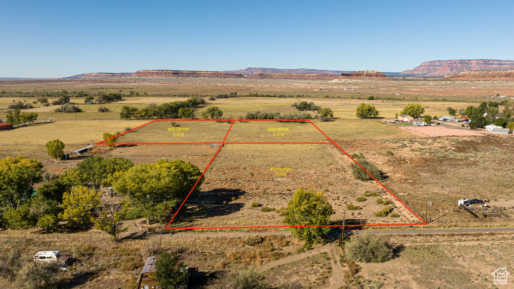 Birds eye view of property featuring a mountain view and a rural view